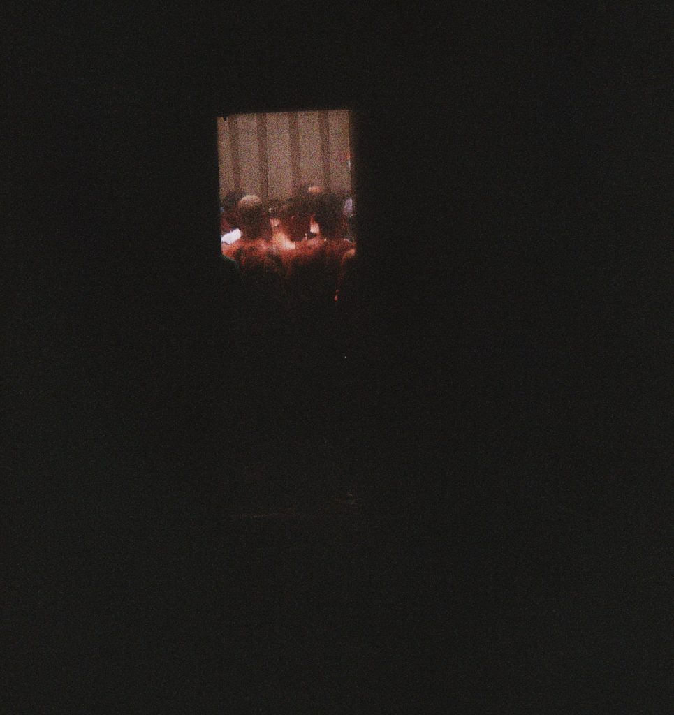 an obscure photo of a darkened doorway at a nightclub.